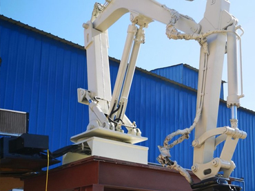 Penggunaan manipulator casting di depan oven